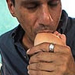 Brunette teen gets a cum bath on her feet and licks it off