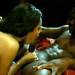 Her tongue teases the head of his cock