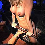 Horny blonde stripper lays back and rubs her pussy on stage