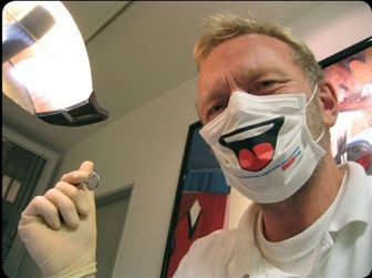 masked dentist